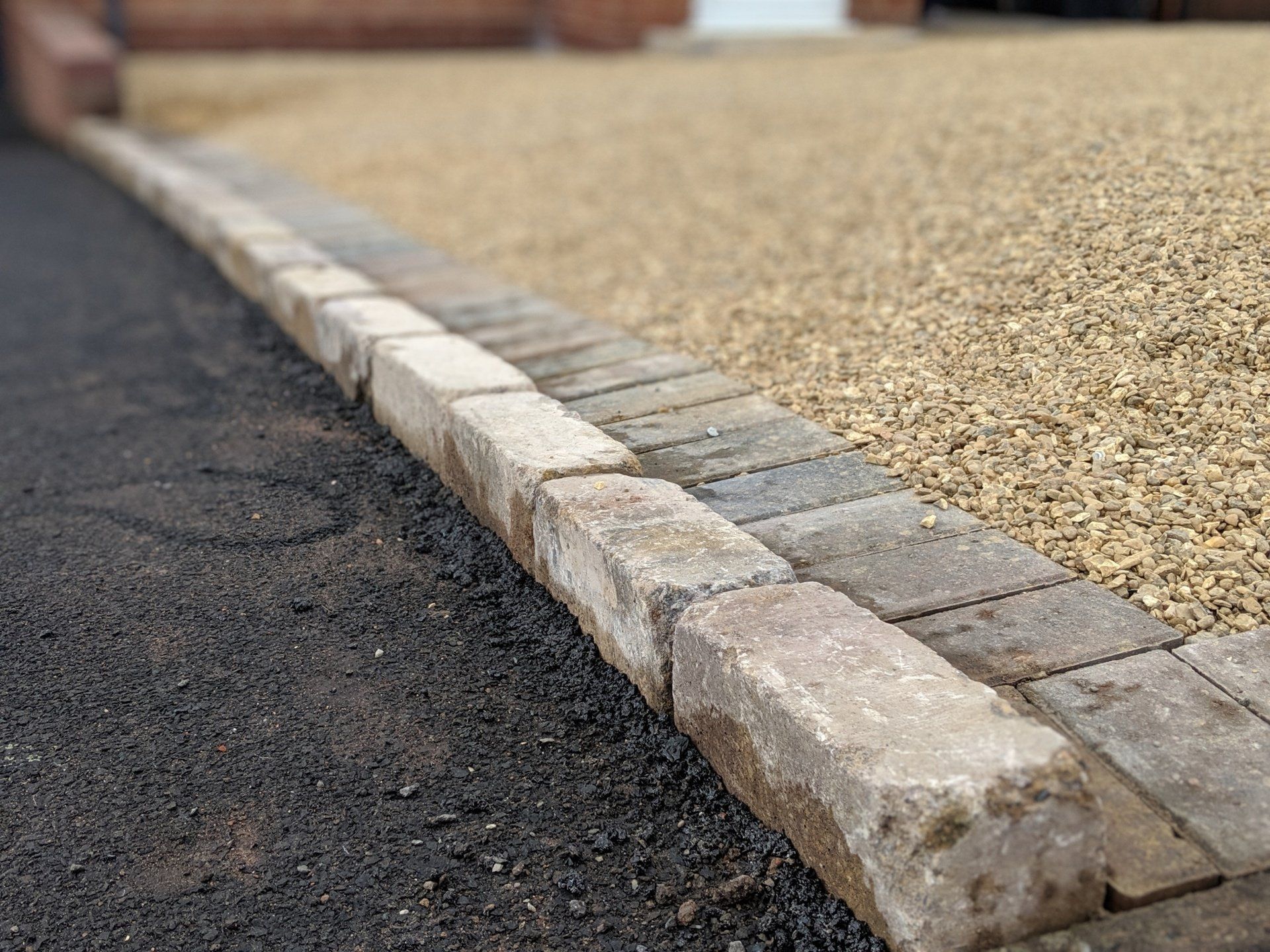 Curb stone edging to neighbours drive
