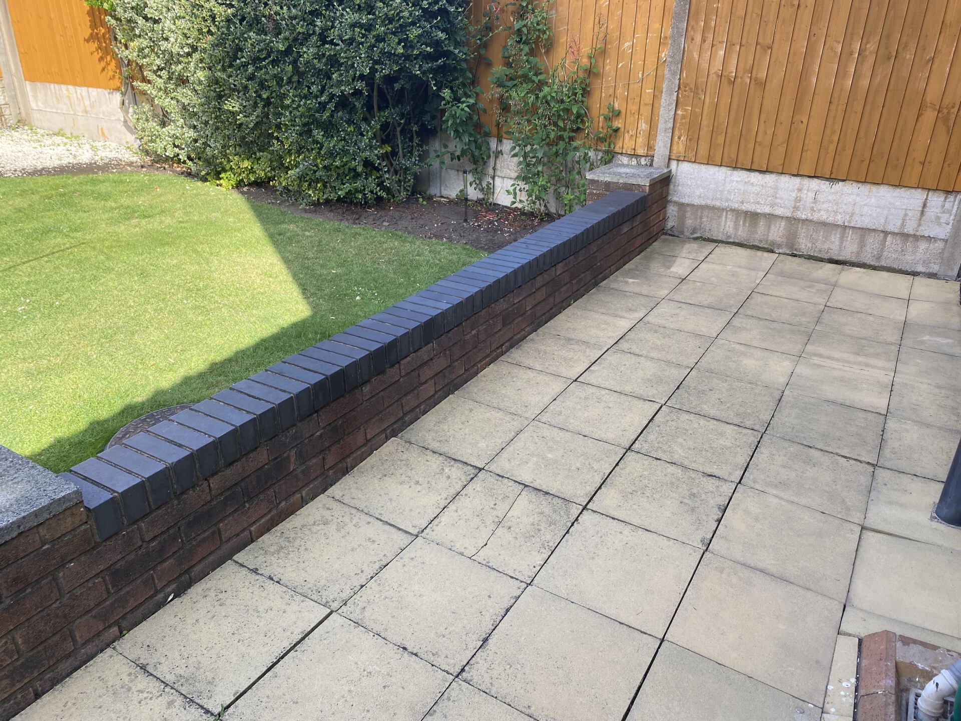 Old patio and dwarf wall in Gornal