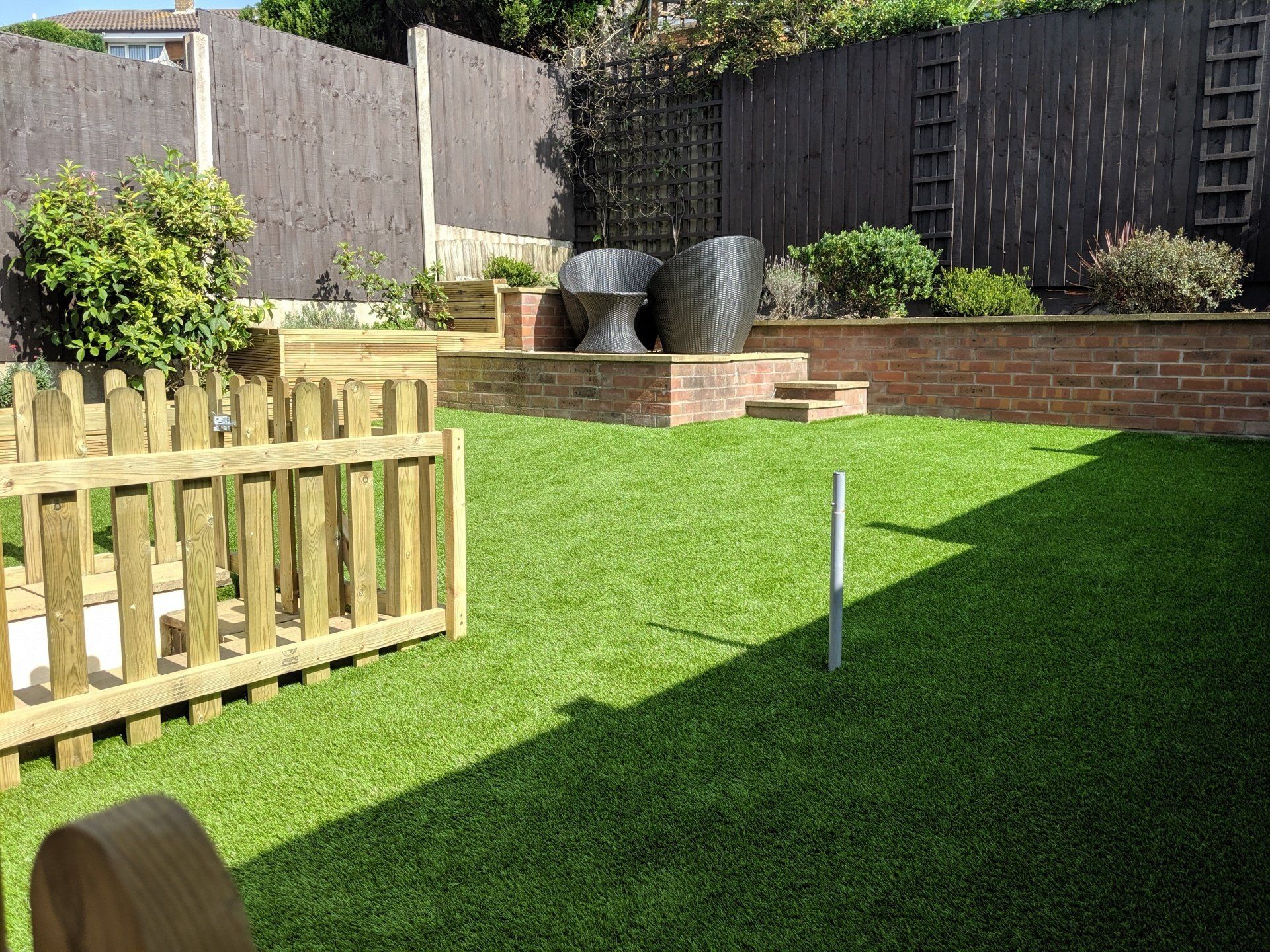 Astro turf with picket fence in Dudley