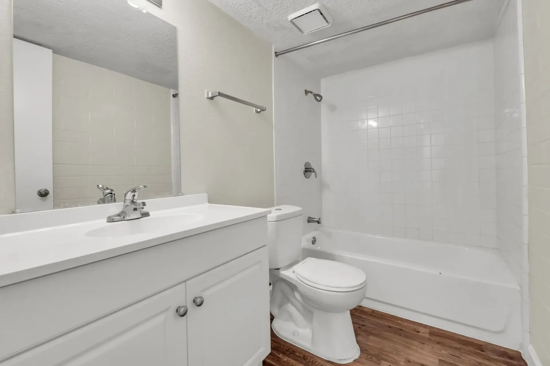 a bathroom with a toilet a sink and a mirror