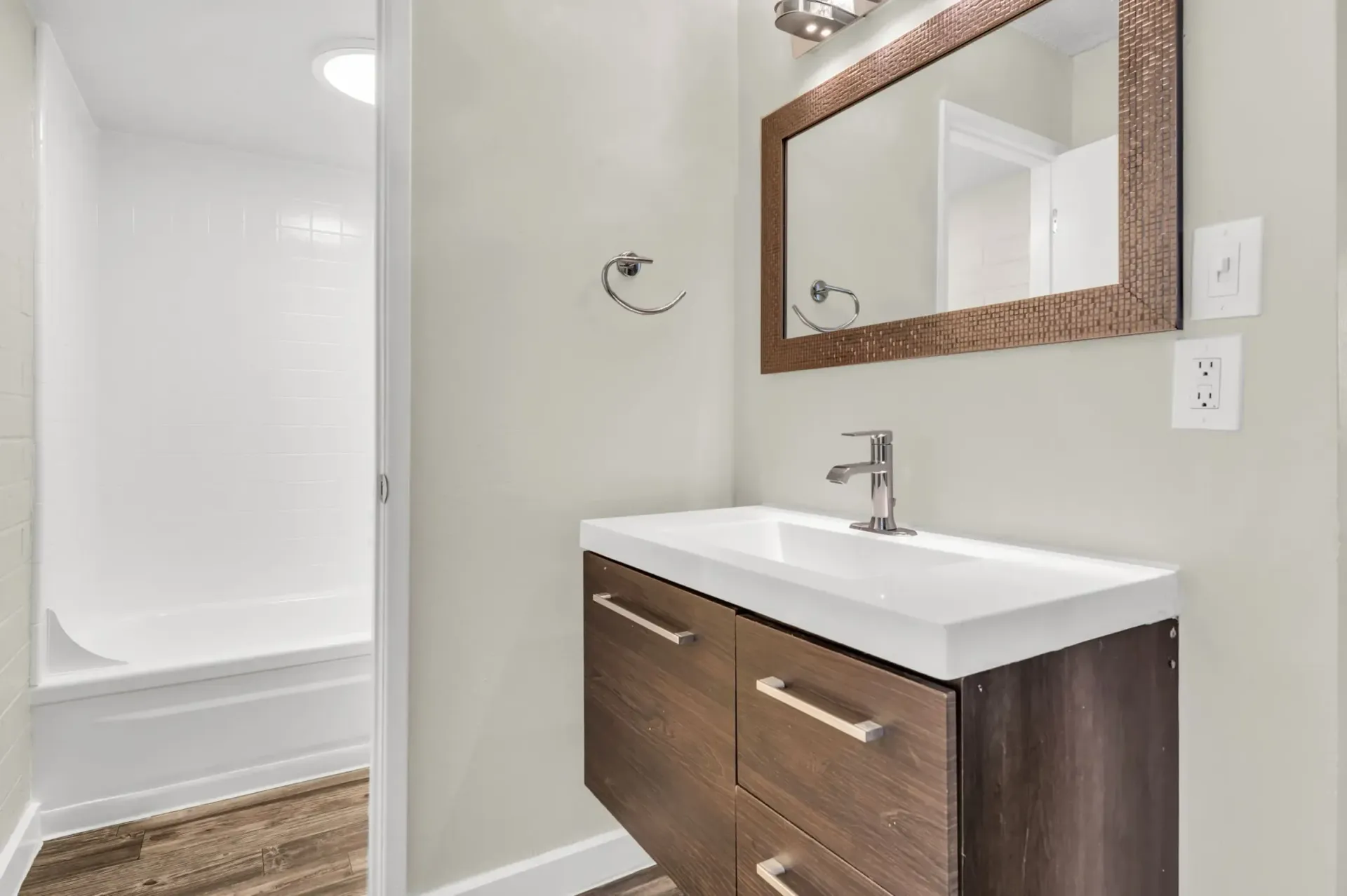 a bathroom with a sink and a mirror
