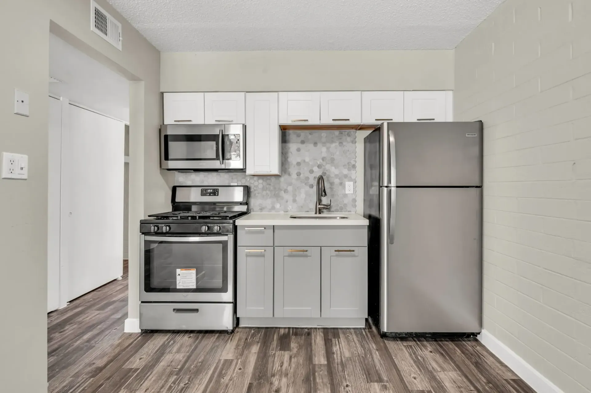 a kitchen with stainless steel appliances including a frigidaire refrigerator
