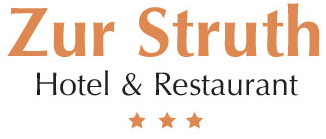 Ein Logo für das Hotel und Restaurant Zur Wahrheit mit drei Sternen