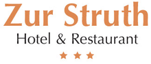 Ein Logo für das Hotel und Restaurant Zur Wahrheit mit drei Sternen