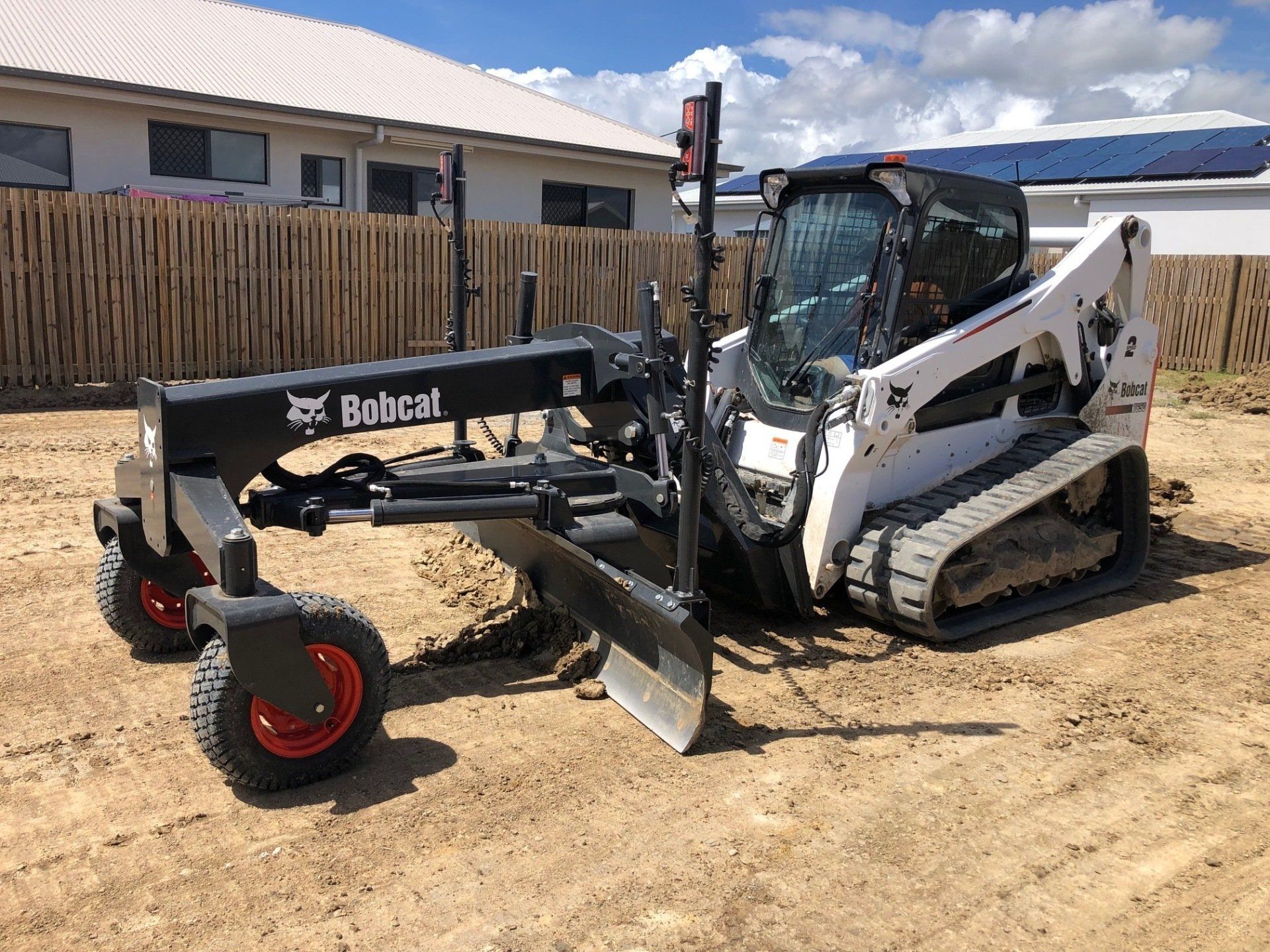White Bobcat Excavator — Builders in Ingham, QLD