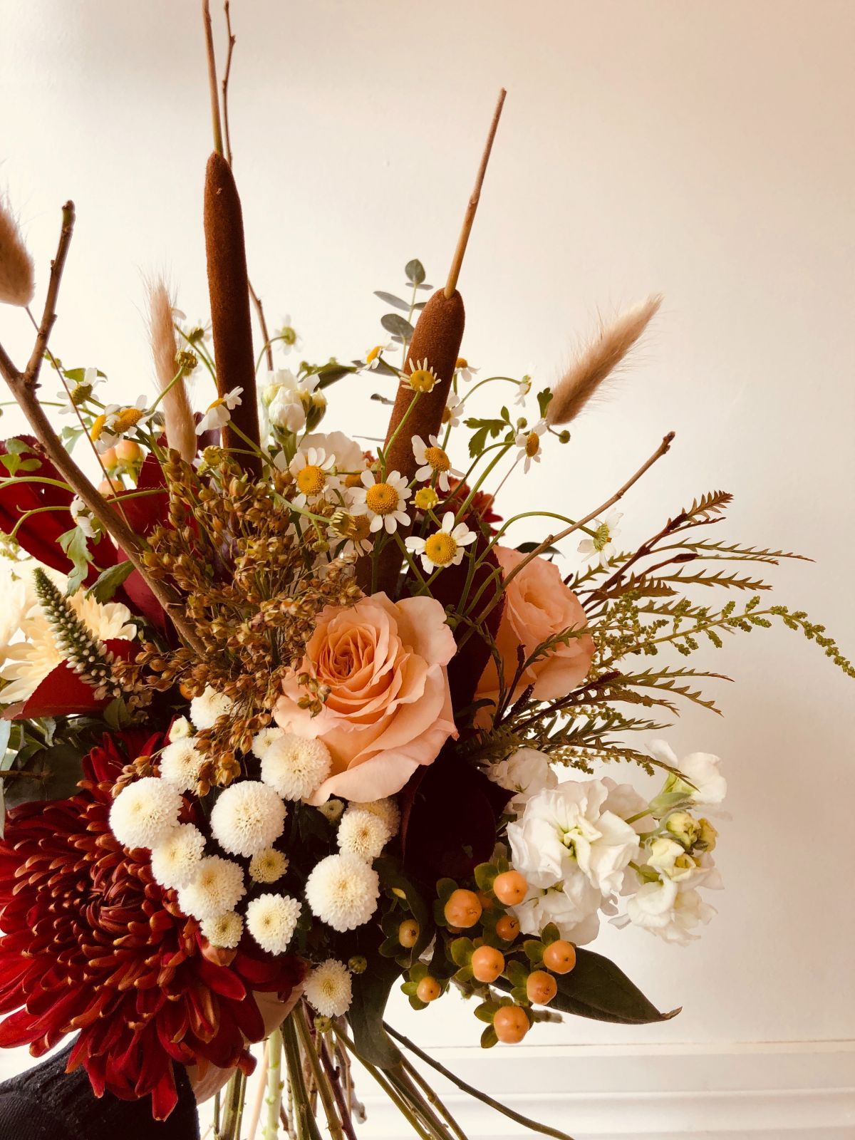 A close up of a bouquet of flowers on a table