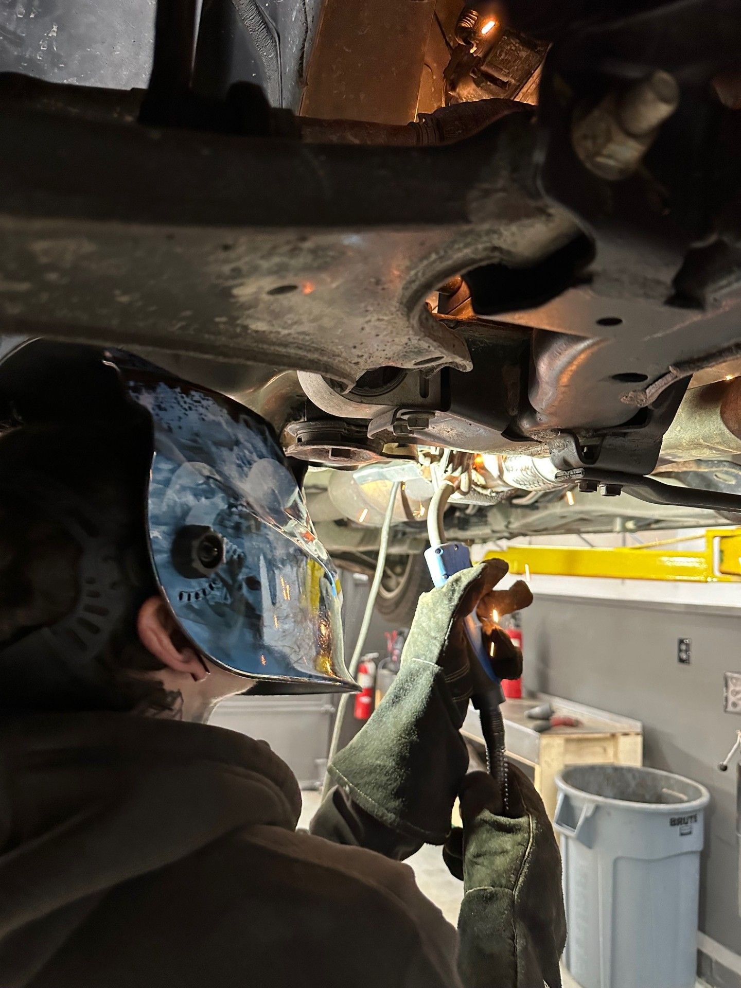 Mechanic Welding Underneath a Car | Gary Jackson Motors