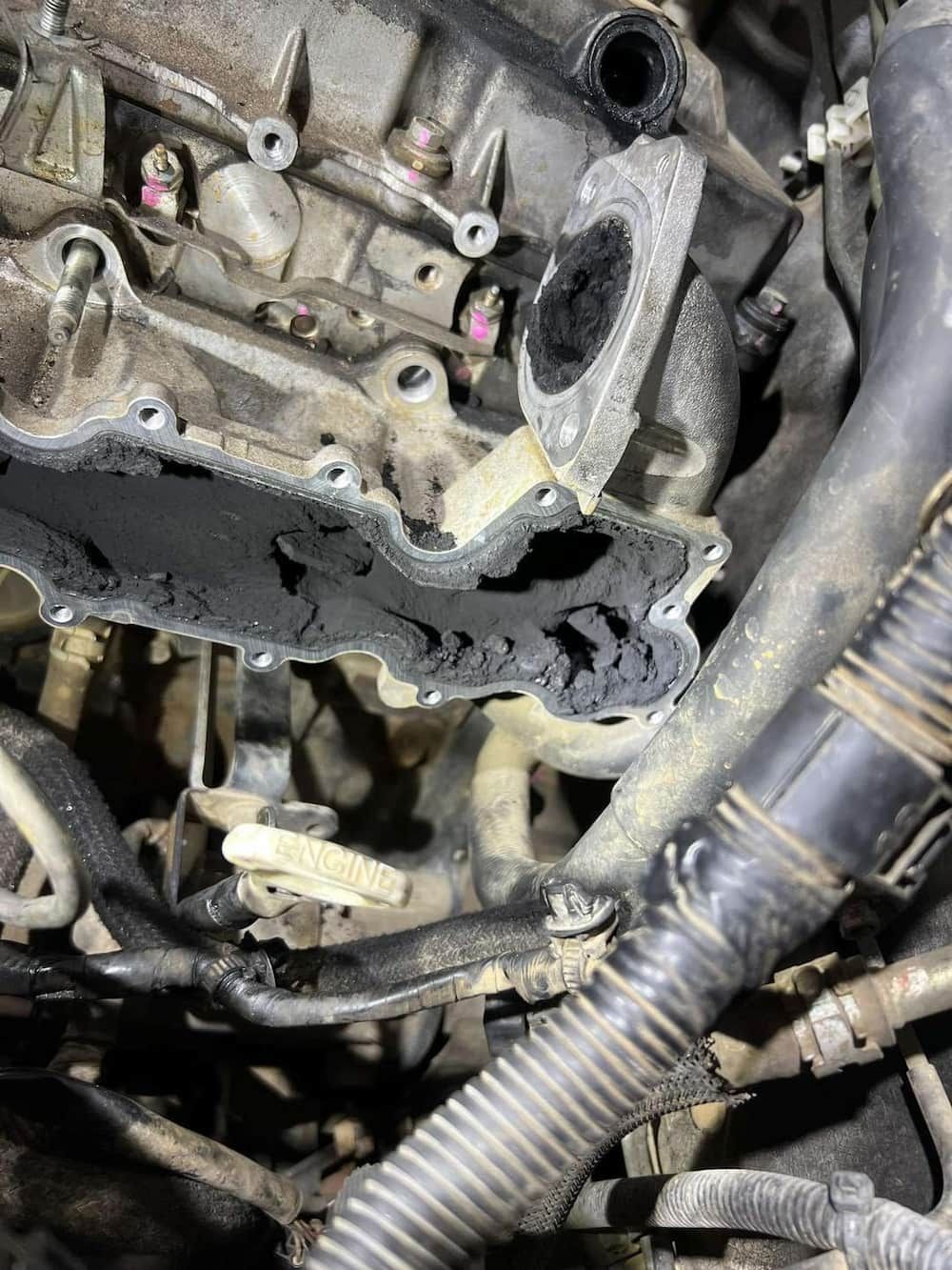 A Close Up Of A Dirty Engine With A Hose Attached To It — Dynolink In Garbutt, QLD