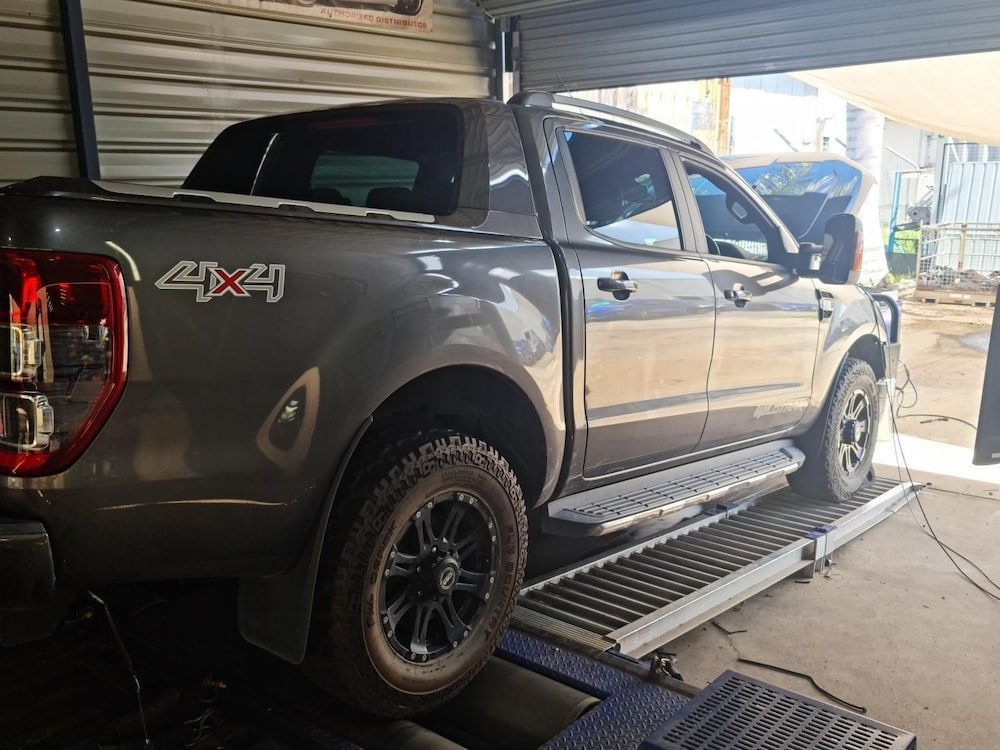 A Ford Ranger Is Sitting On A Ramp In A Garage — Dynolink In Garbutt, QLD