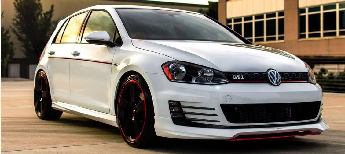 A White Volkswagen Golf Is Parked In A Parking Lot In Front Of A Building — Dynolink In Garbutt, QLD