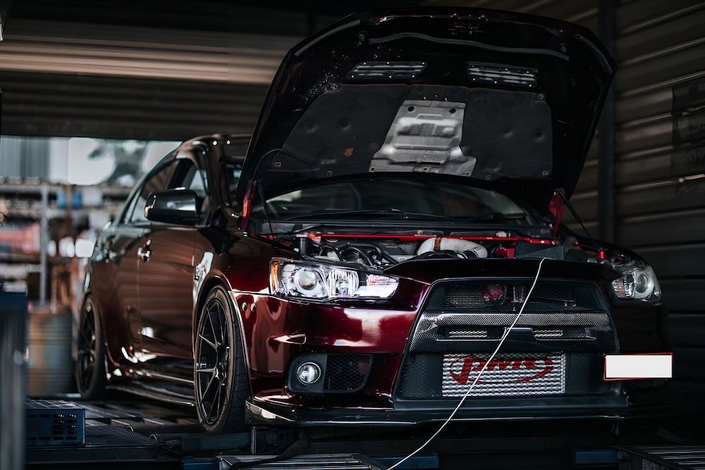 A Close Up Of A Red Car Engine — Dynolink In Garbutt, QLD