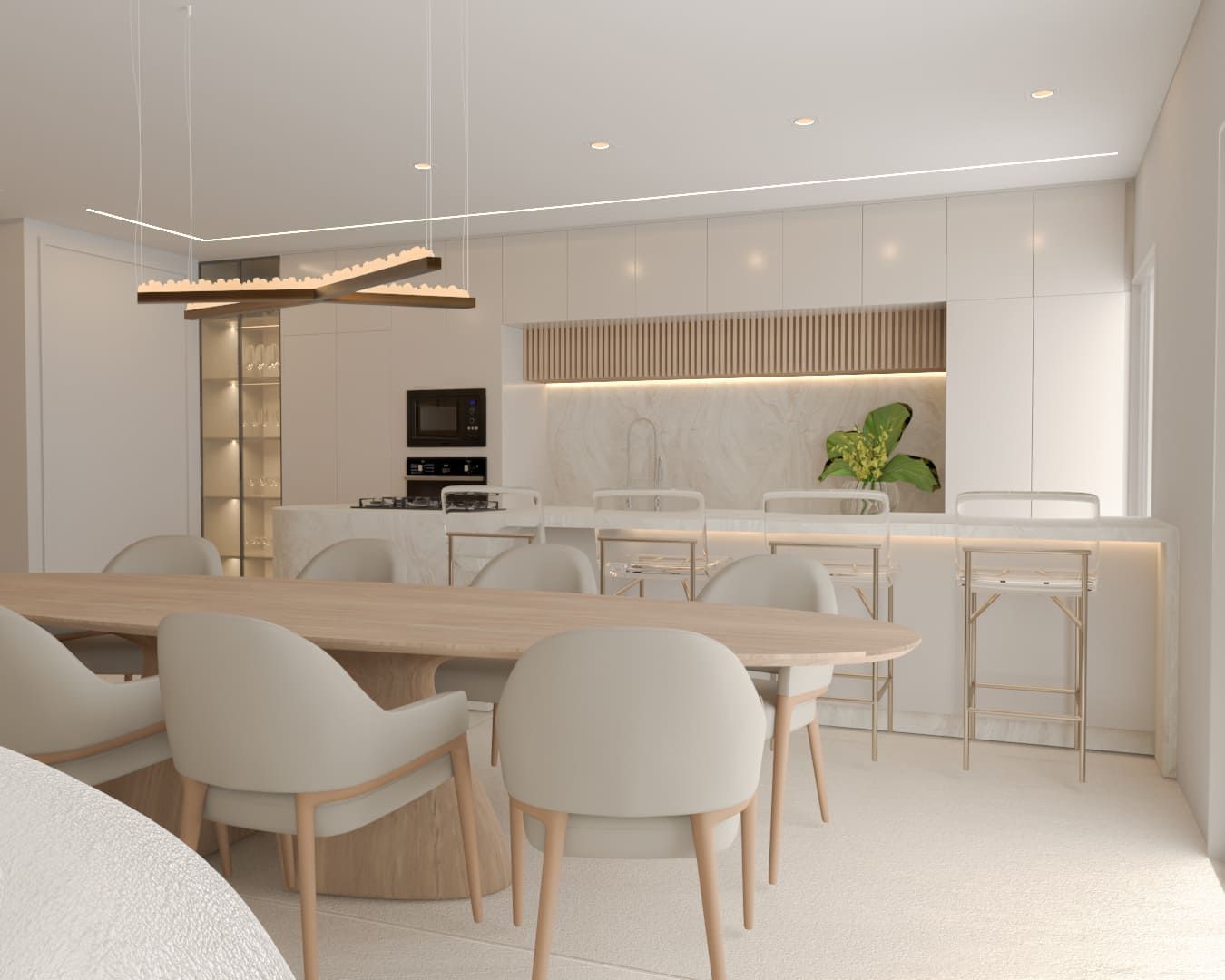 Uma sala de jantar com mesa e cadeiras e uma cozinha ao fundo