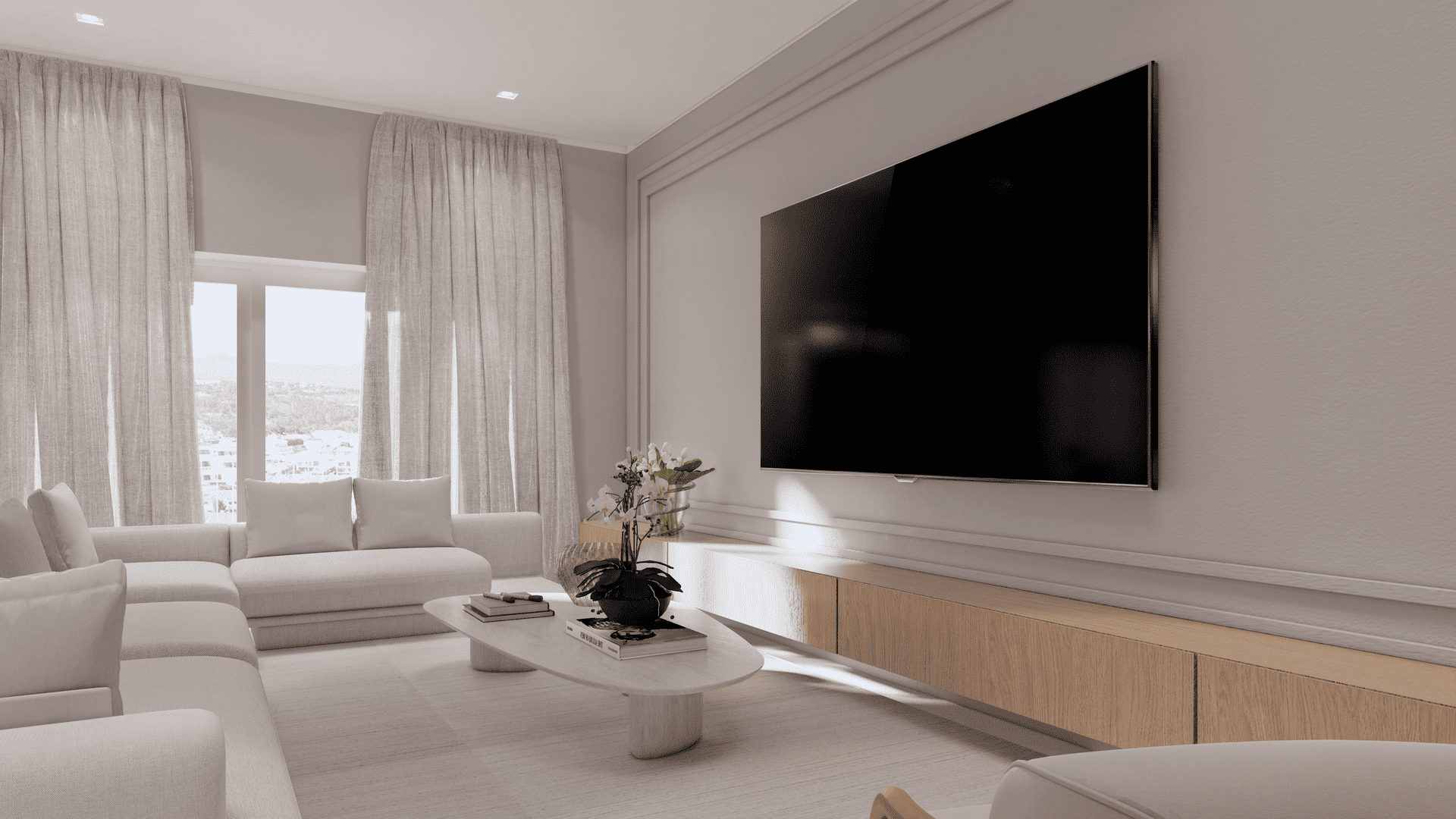 Uma sala de estar com uma grande TV de tela plana na parede.