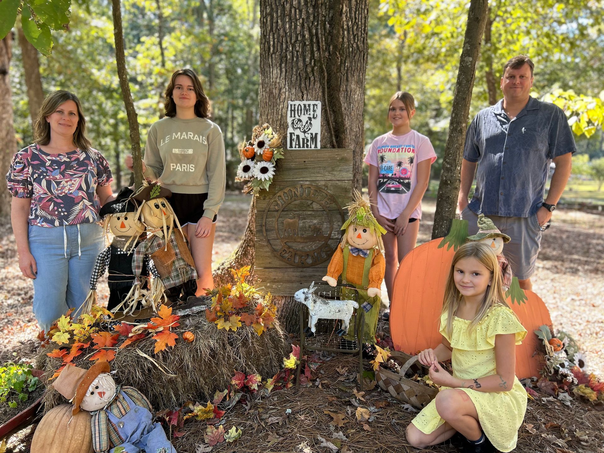 A child is running towards a tent in a field.