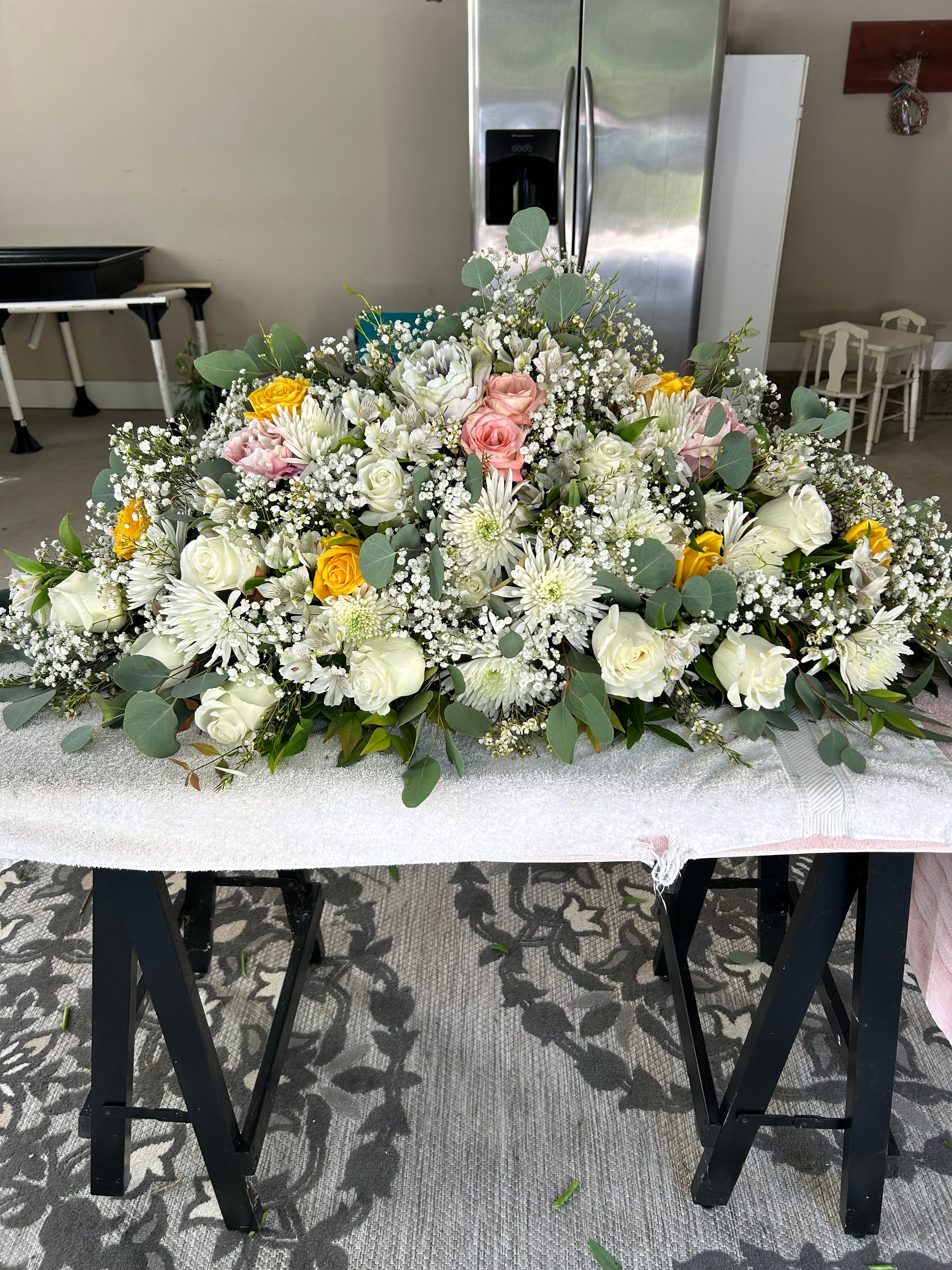 A large bouquet of flowers is sitting on top of a table.