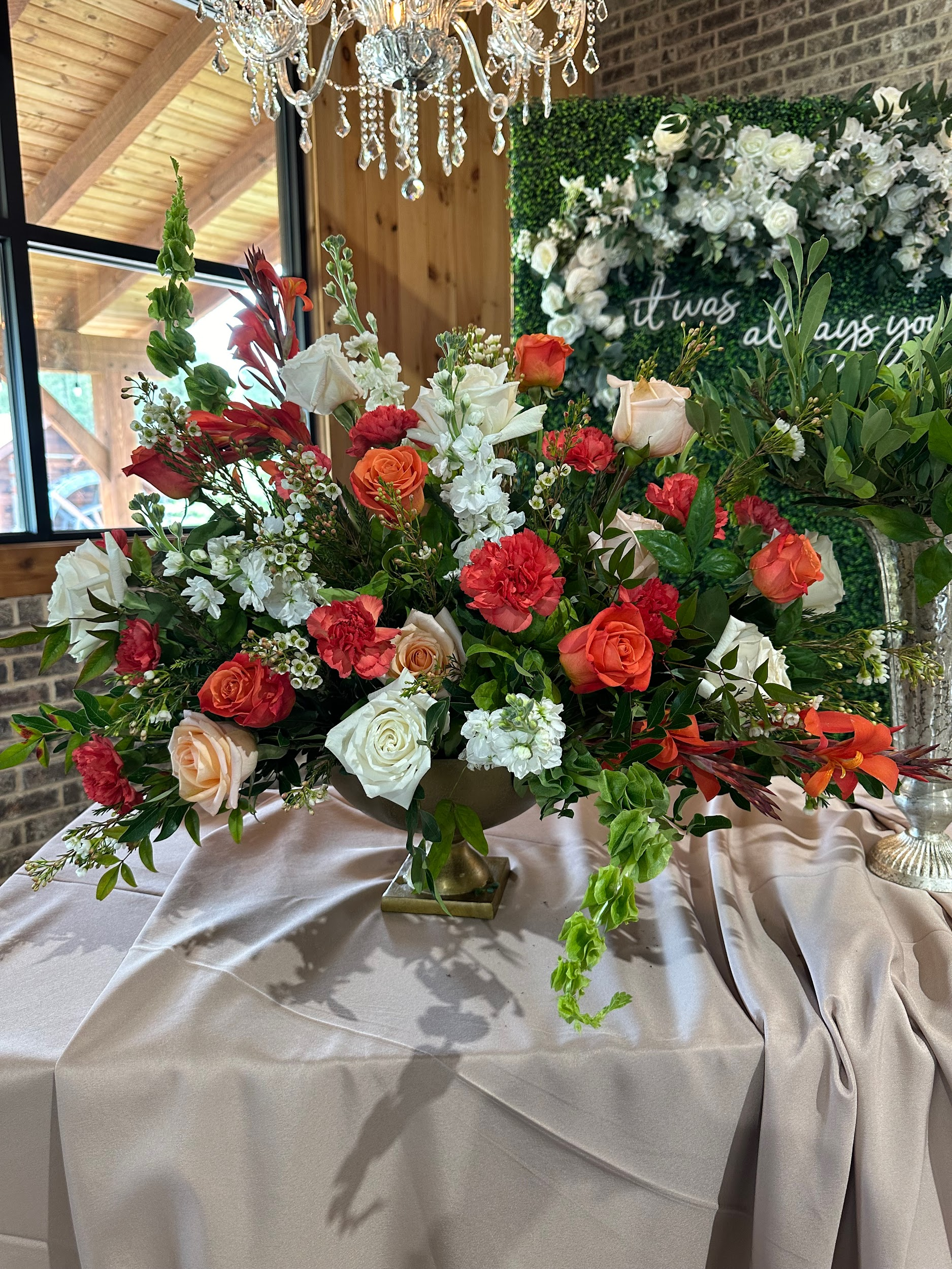 A vase filled with flowers is sitting on a table.