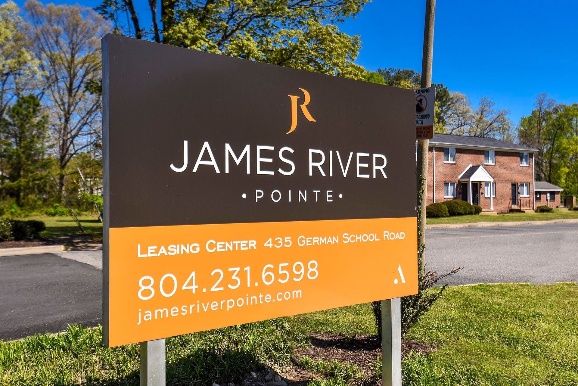 Sign for James River Pointe apartments with contact information.