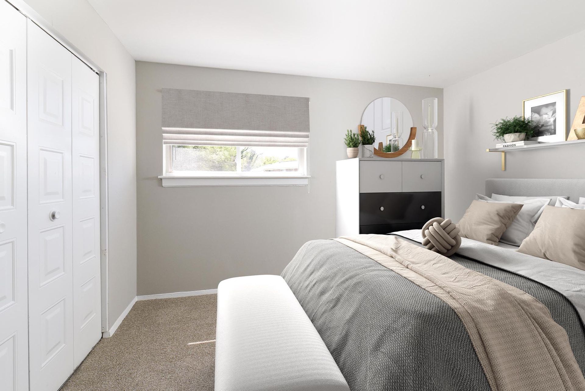 Bedroom with bed, dresser, window, and closet. Neutral colors and natural light create a calm atmosphere.