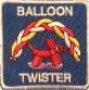 A picture of a balloon twister with a dog on it.