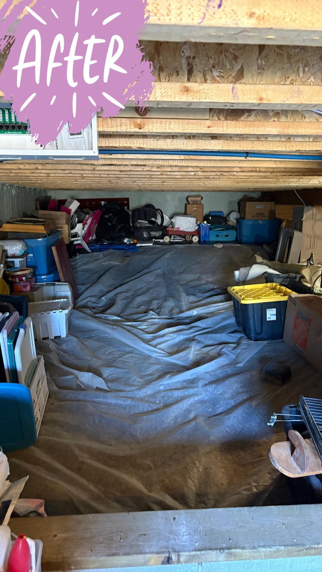 A messy storage room under a wooden structure, filled with various containers and boxes, after a cleaning.