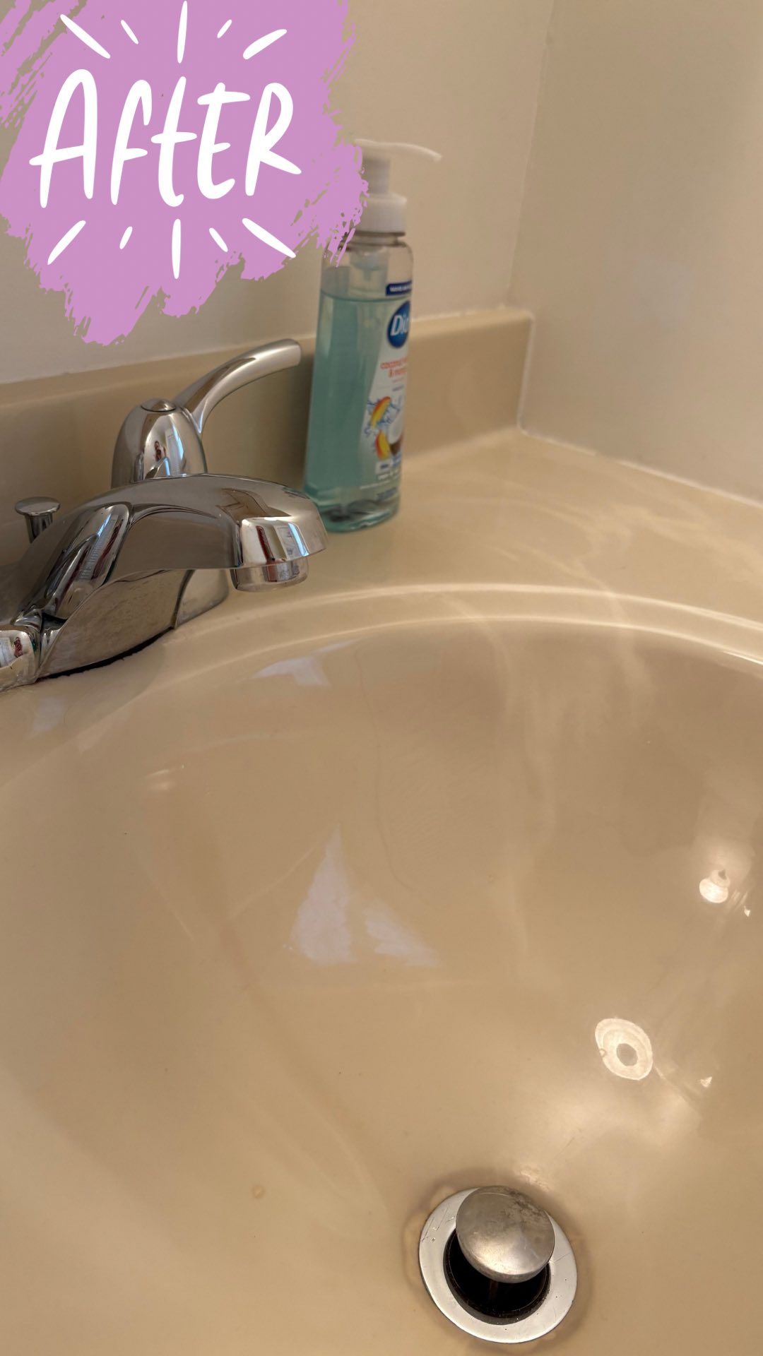 Clean bathroom sink, chrome faucet, soap dispenser, white countertop, 