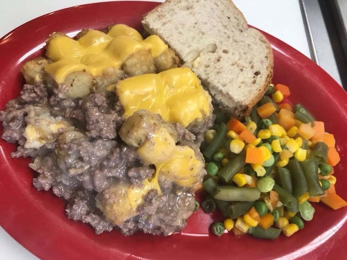 A plate of food with bread and vegetables on it