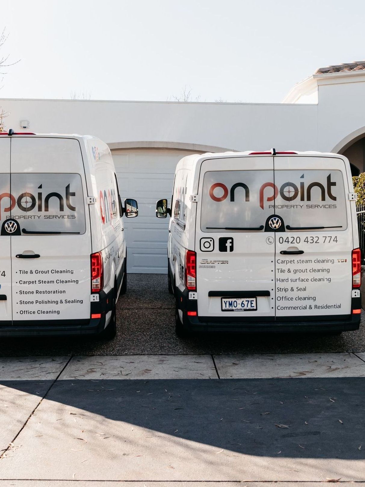 Two on point vans are parked in front of a house