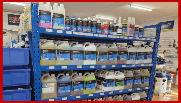 A shelf filled with lots of cleaning supplies in a store.