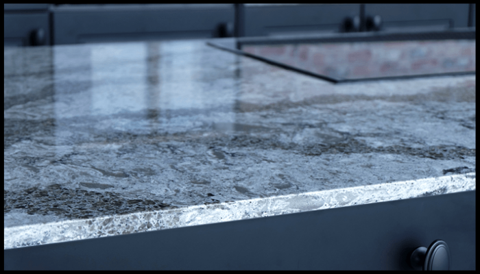 A close up of a granite counter top in a kitchen