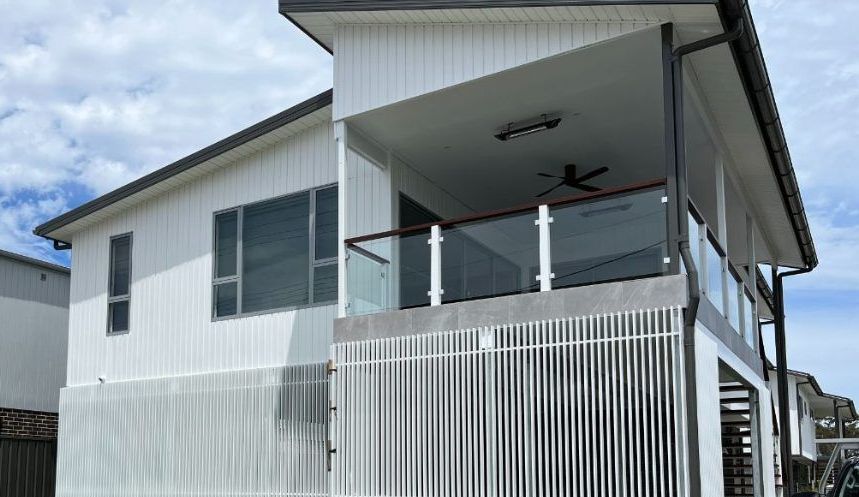 A White House With a Balcony and a Ceiling Fan — Febos Welding and Engineering In Corrimal, NSW