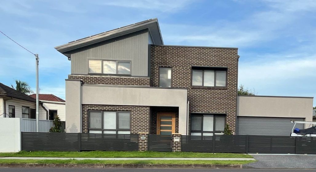 A Large House With a Car Parked in Front of It  — Febos Welding and Engineering In Corrimal, NSW