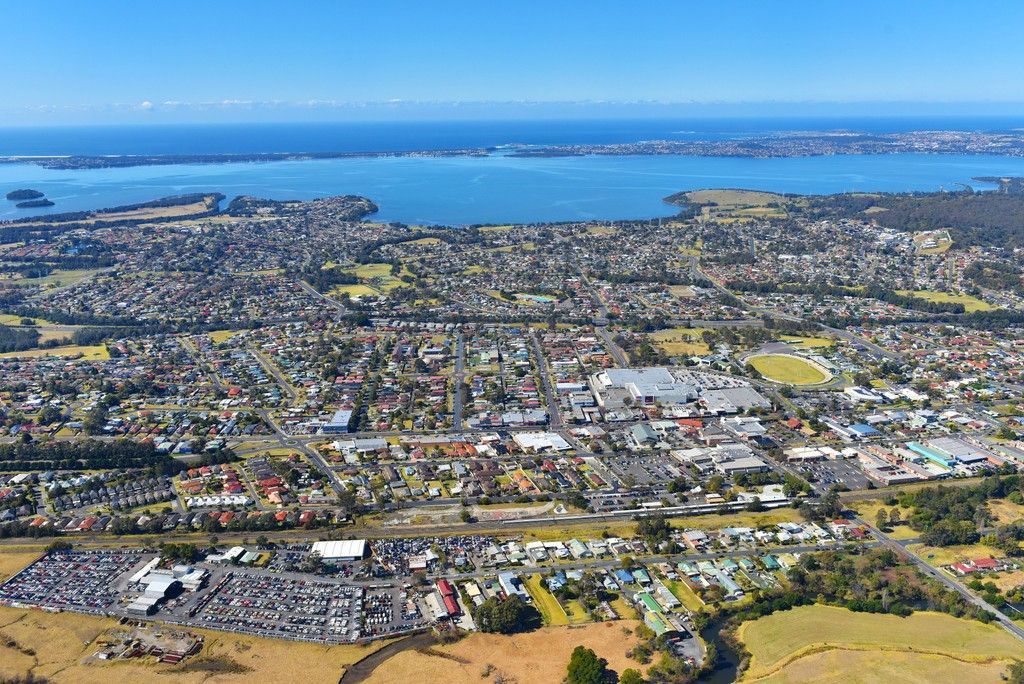 An Aerial View of a City With a Lake in the Background — Febos Welding and Engineering In Dapto, NSW