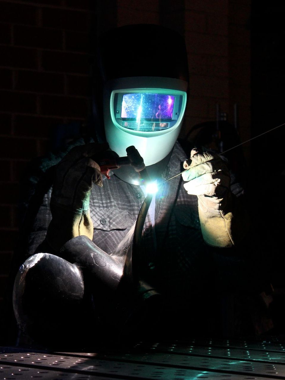 A Man Welding in Workshop  — Febos Welding and Engineering In Corrimal, NSW
