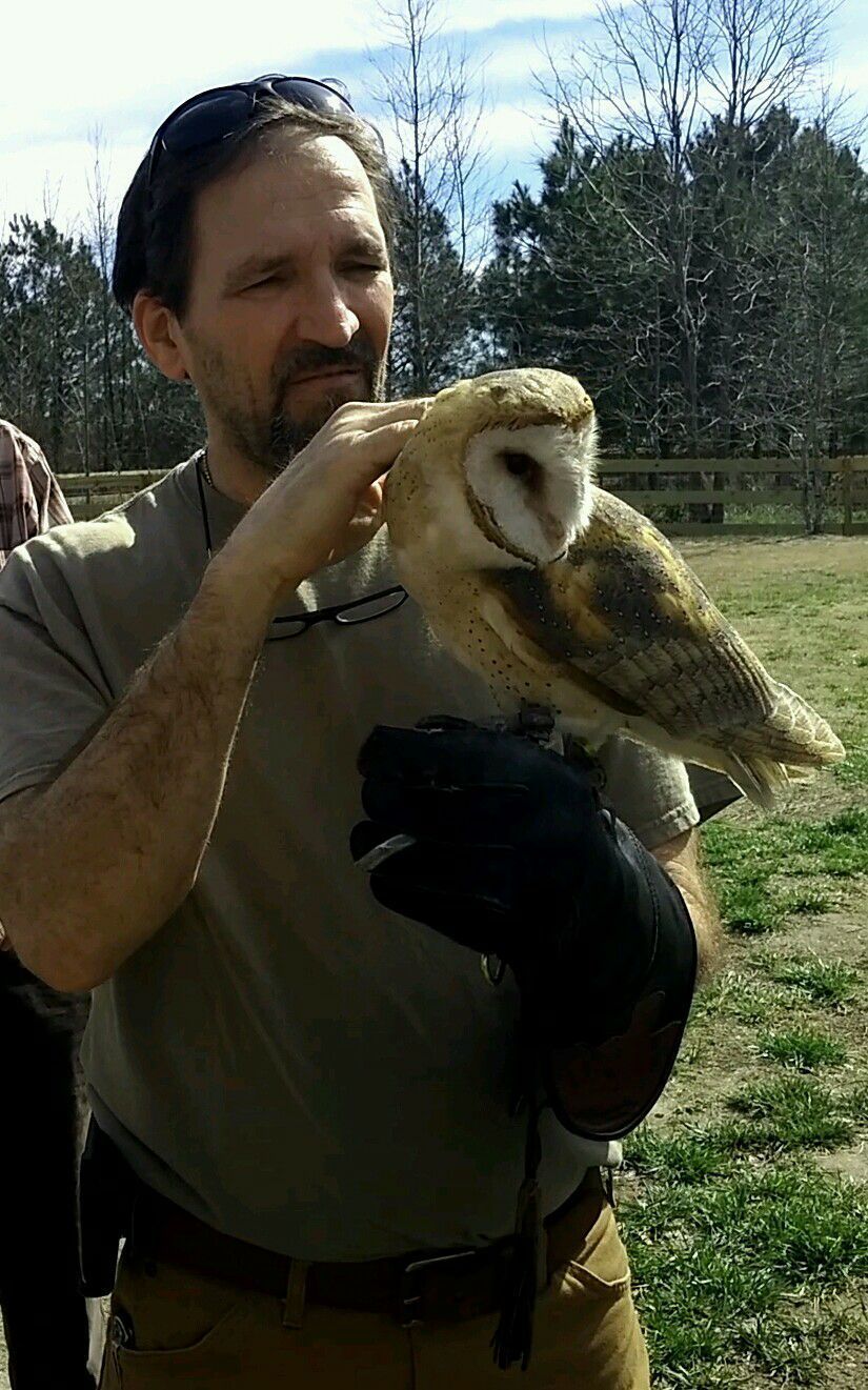 Man Hold An Owl — Greensboro, NC — The Critter Gitter LLC