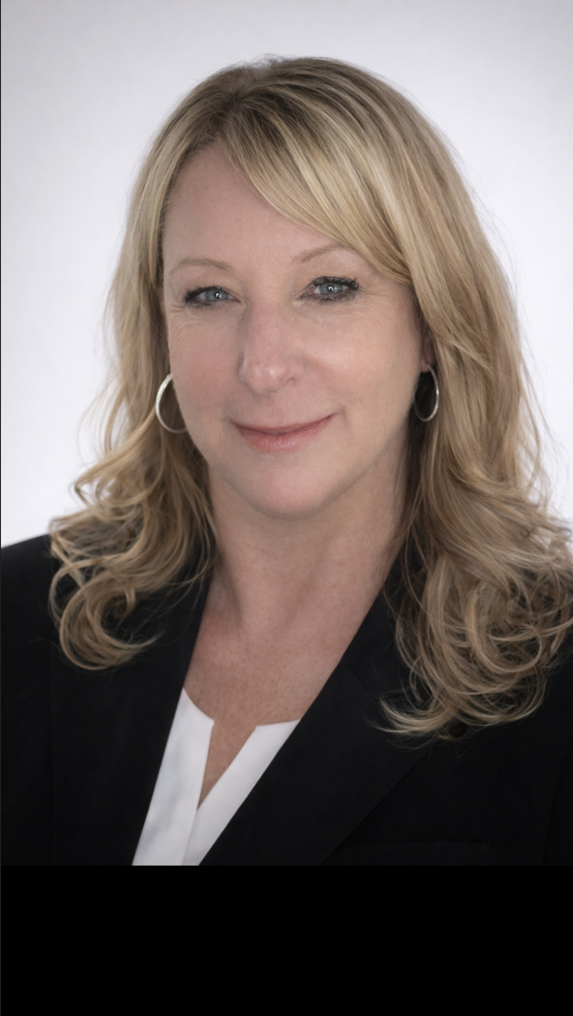 A simple, gray-toned silhouette icon of a person with shoulder-length hair against a solid light gray background.