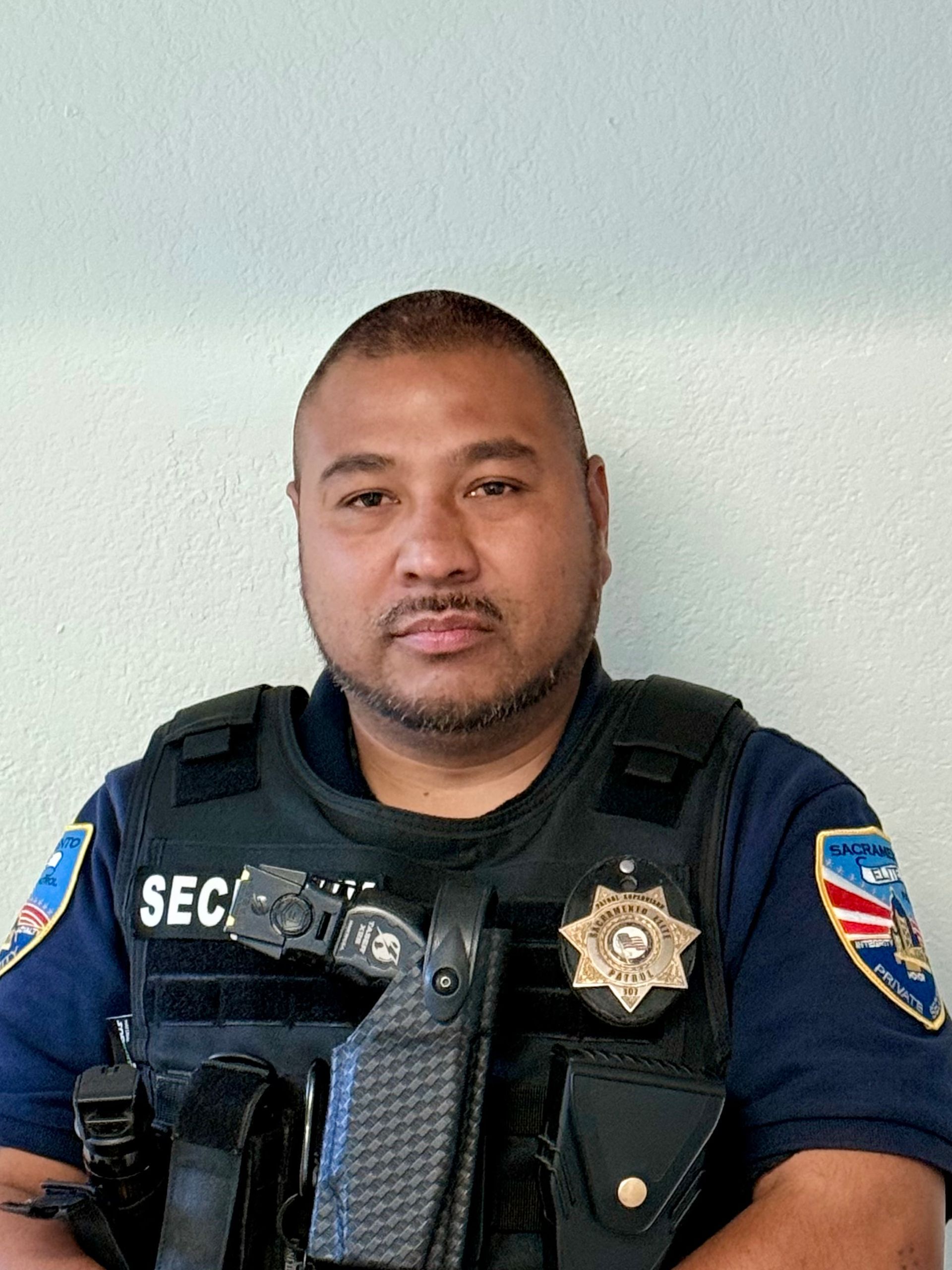 A stylized, grey-toned icon of a person wearing a collared shirt and tie, often used as a default user profile placeholder.