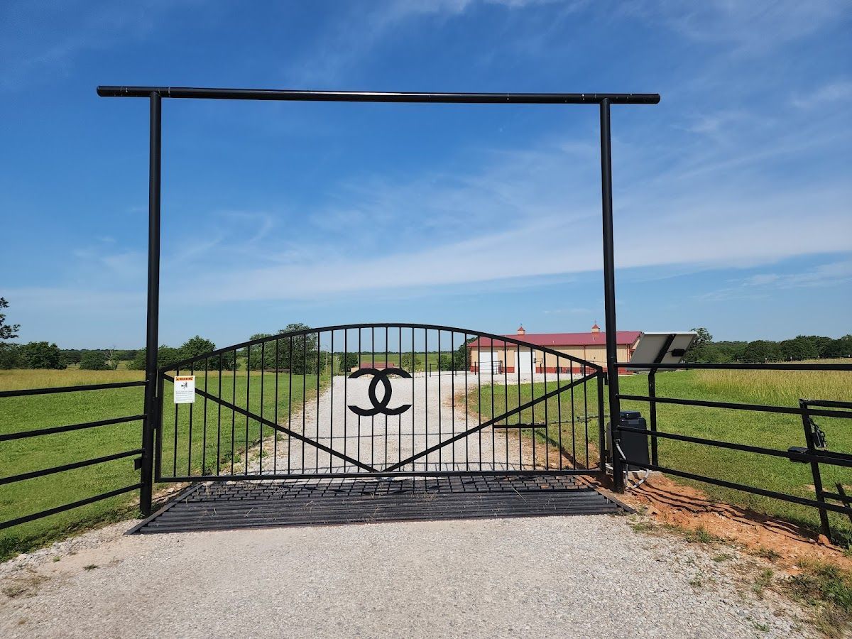 A black metal gate with a chanel logo on it