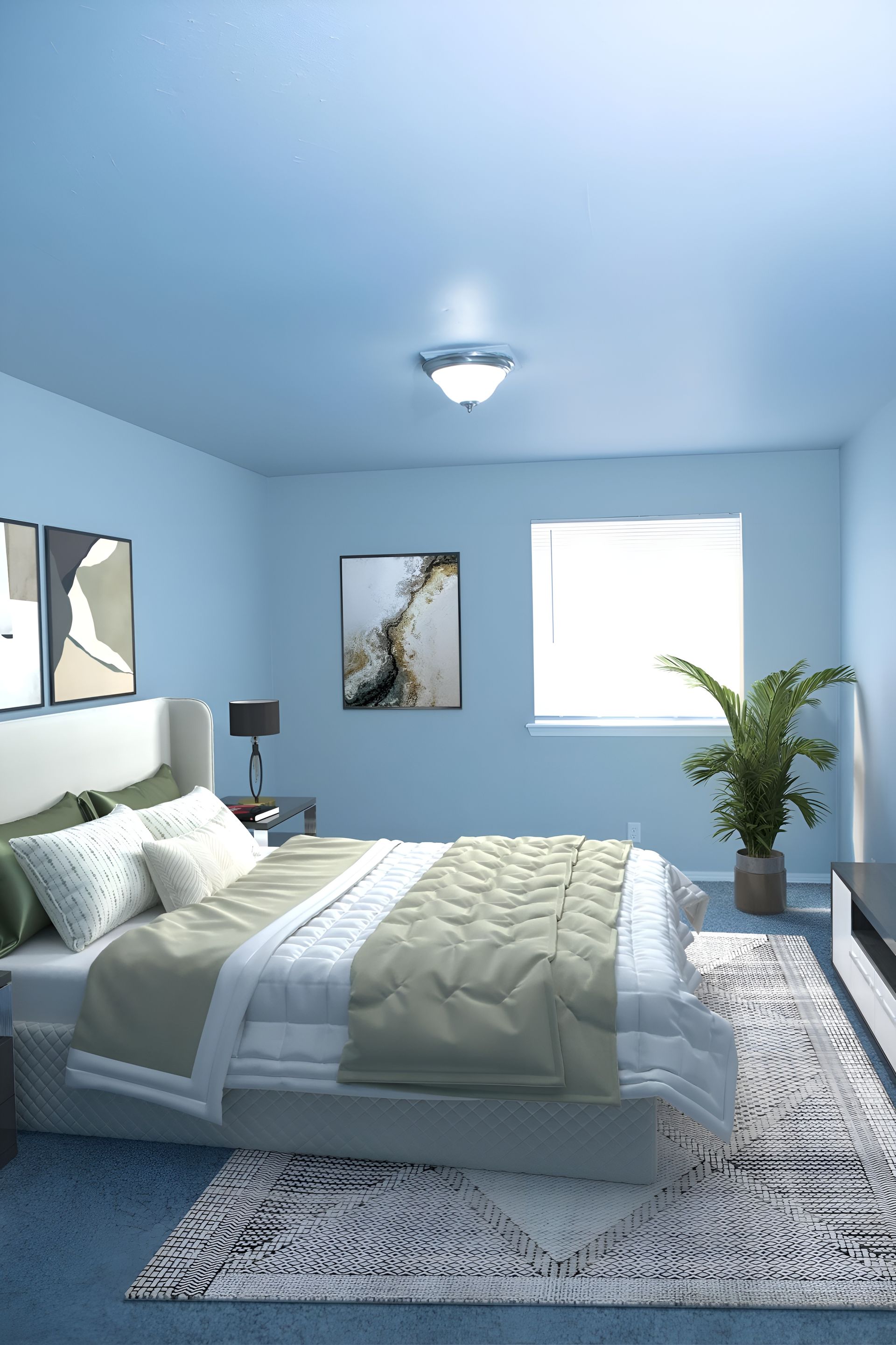 a bedroom with blue walls and a large bed