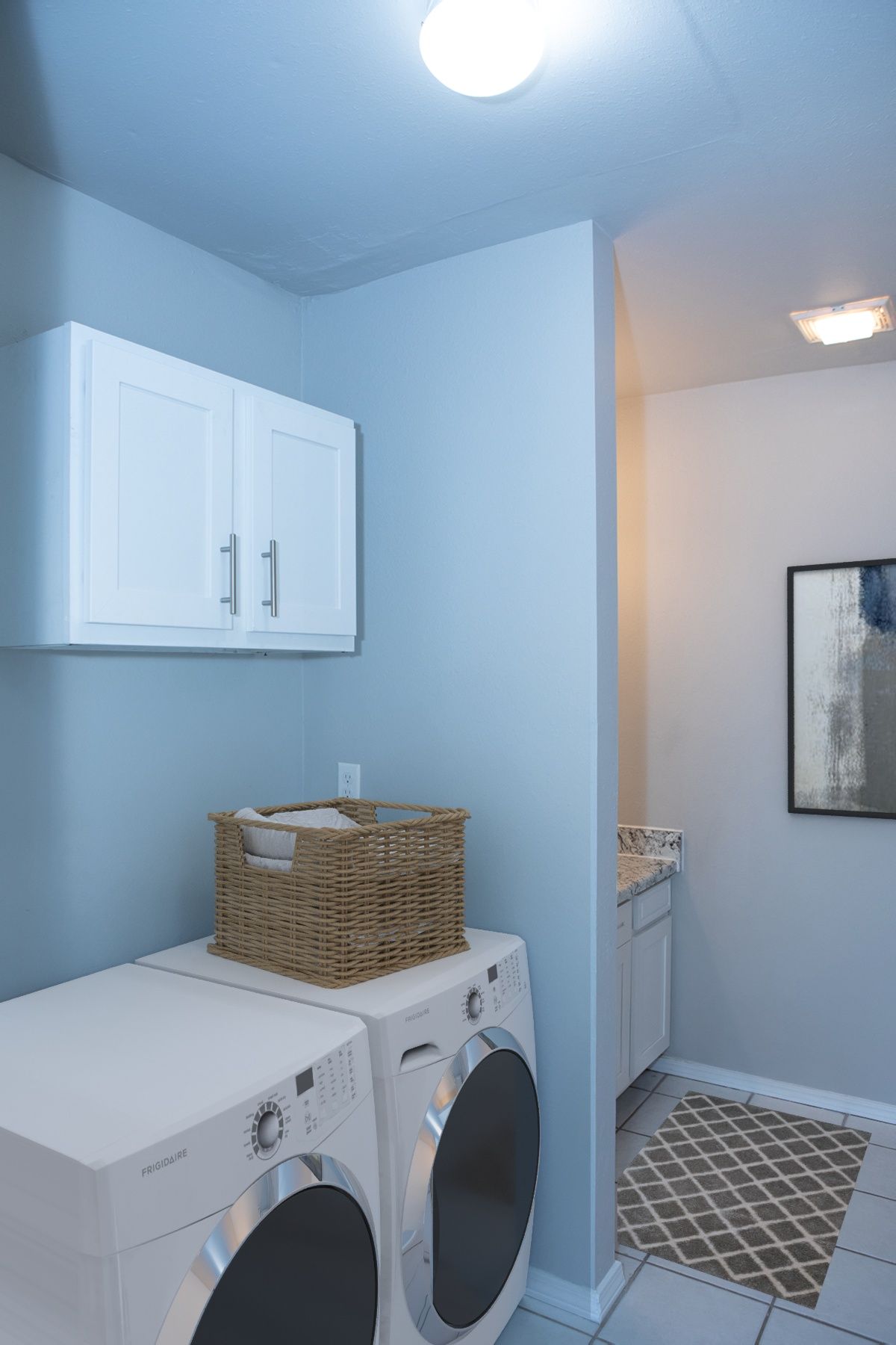 a laundry room with a washer and dryer from frigidaire