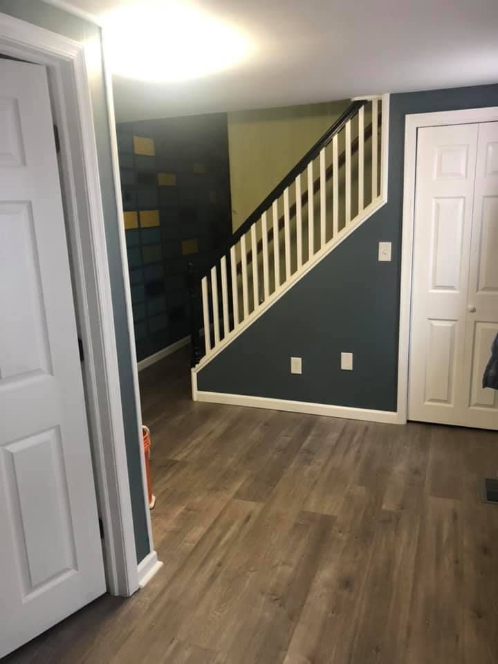 There is a staircase in the corner of the room.