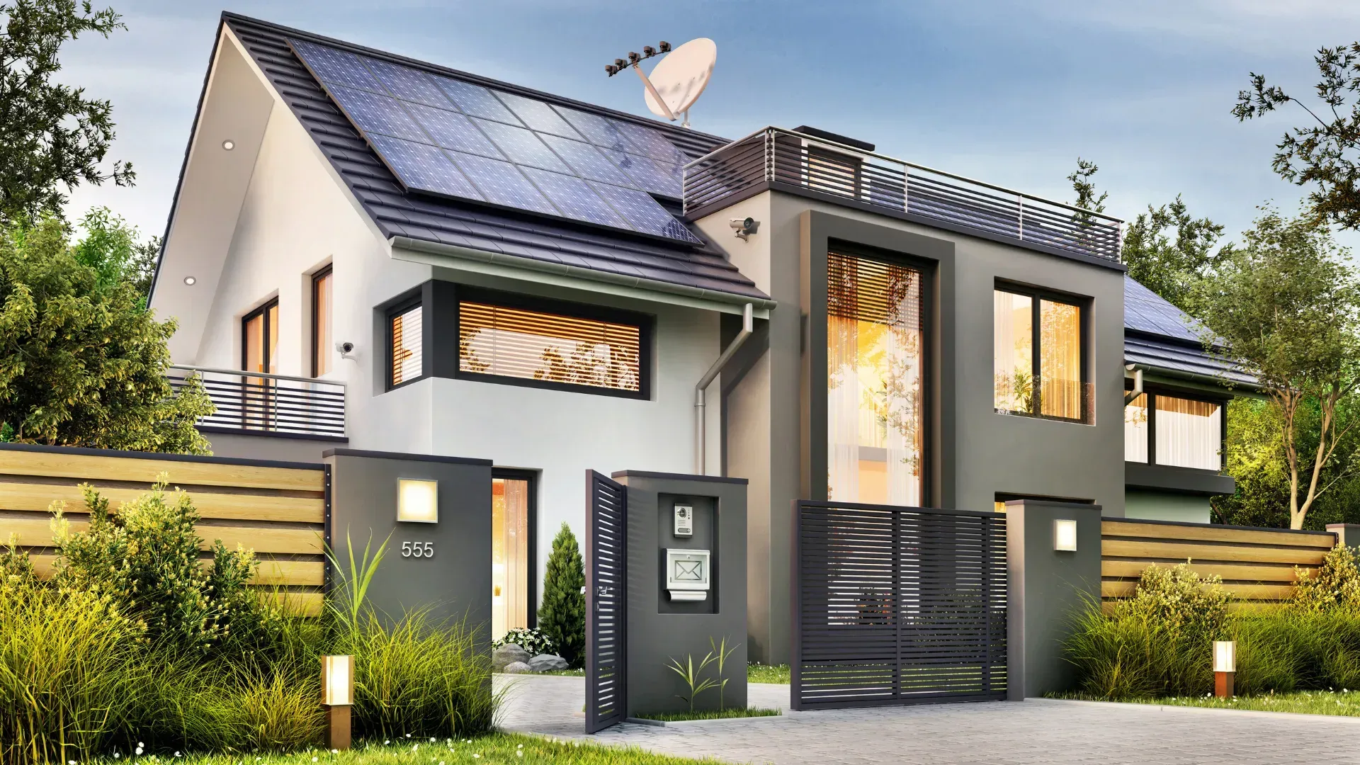 Modern two-story house with solar panels, gray exterior, gated entrance, and landscaped yard.
