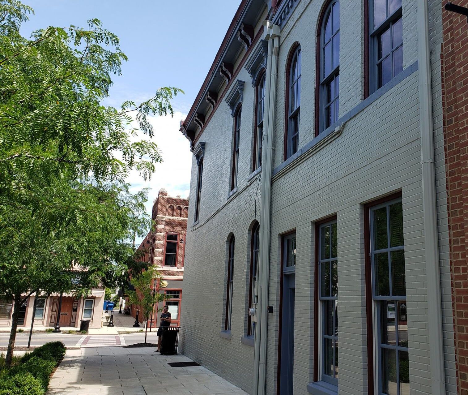A large white brick building with a lot of windows
