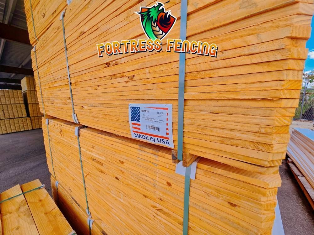 Stack of lumber bundled with straps, labeled