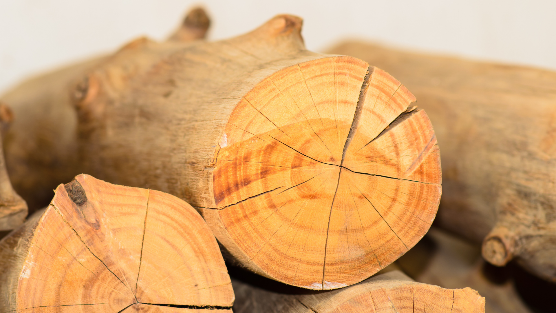 A pile of logs stacked on top of each other on a table.