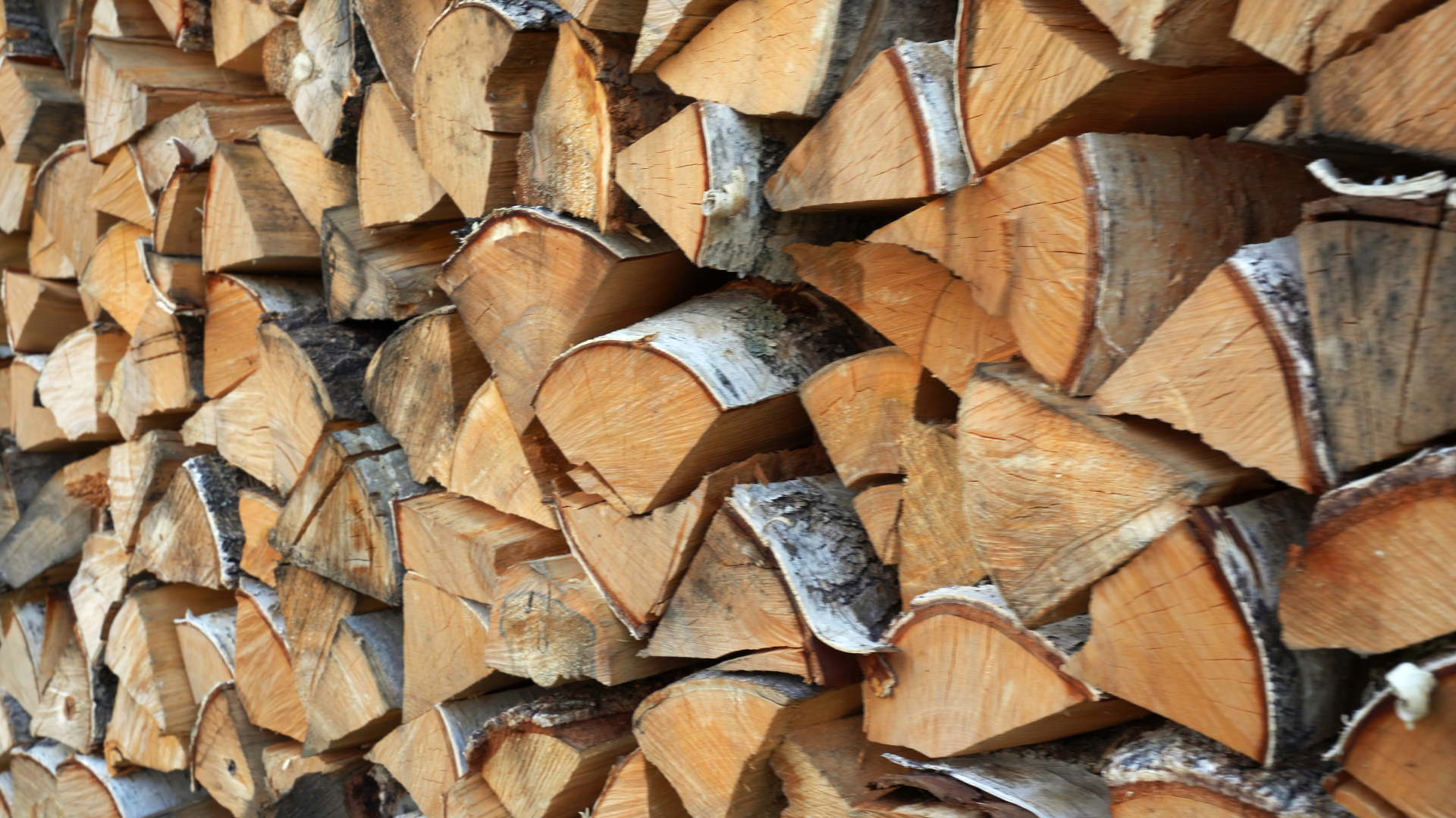 A pile of logs stacked on top of each other.