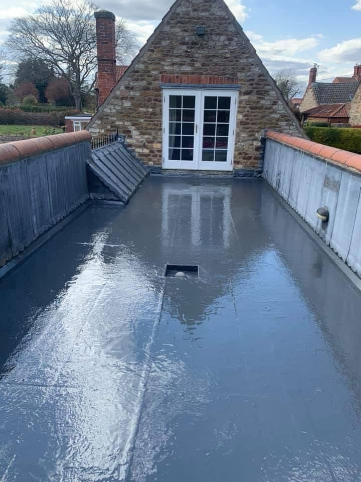 There is a skylight on the roof of a house.