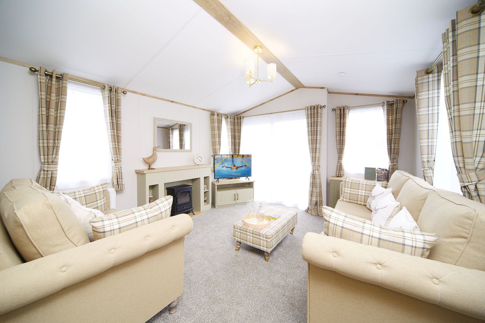 A living room filled with furniture and a television.