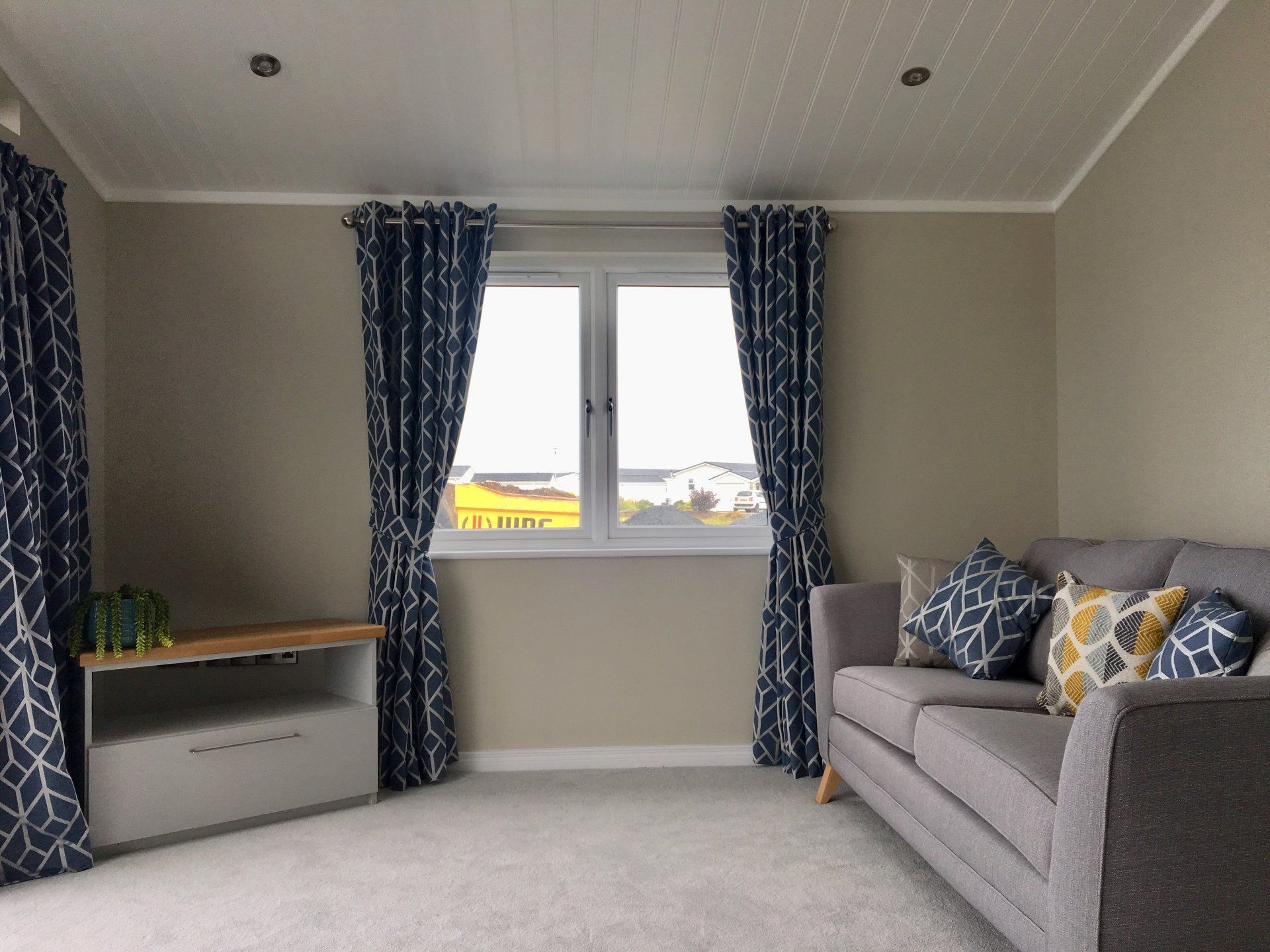 A living room with a couch and a window