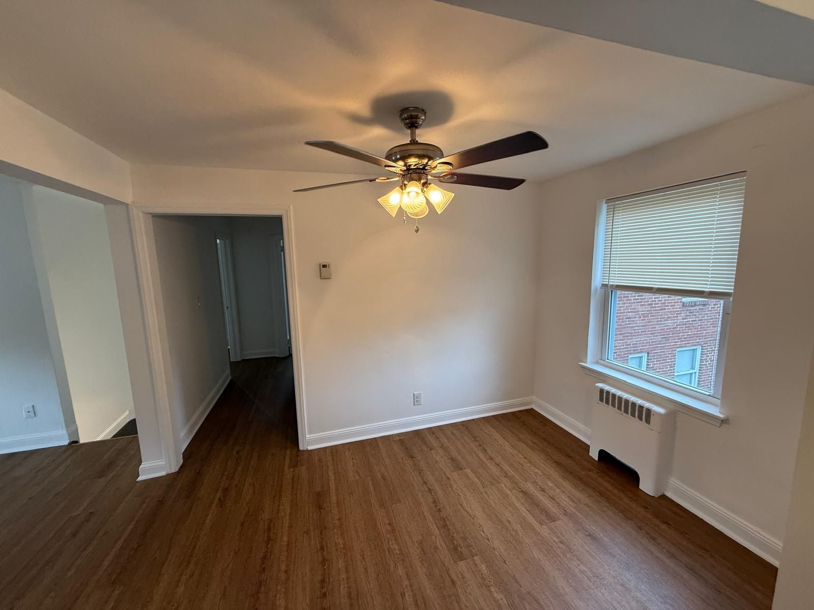 Cozy living room with ceiling fan and window view