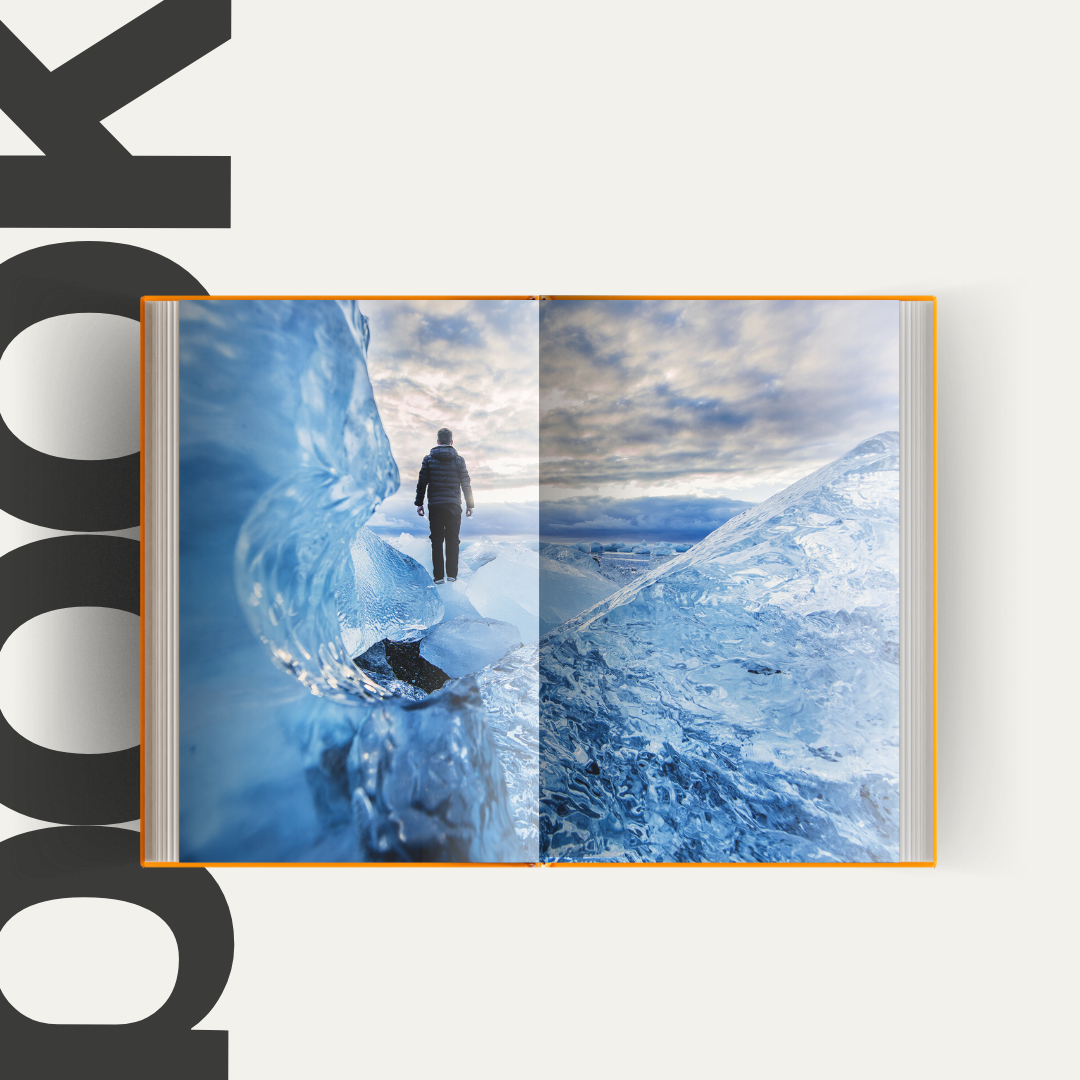A book is open to a page that shows a man standing on top of an iceberg.